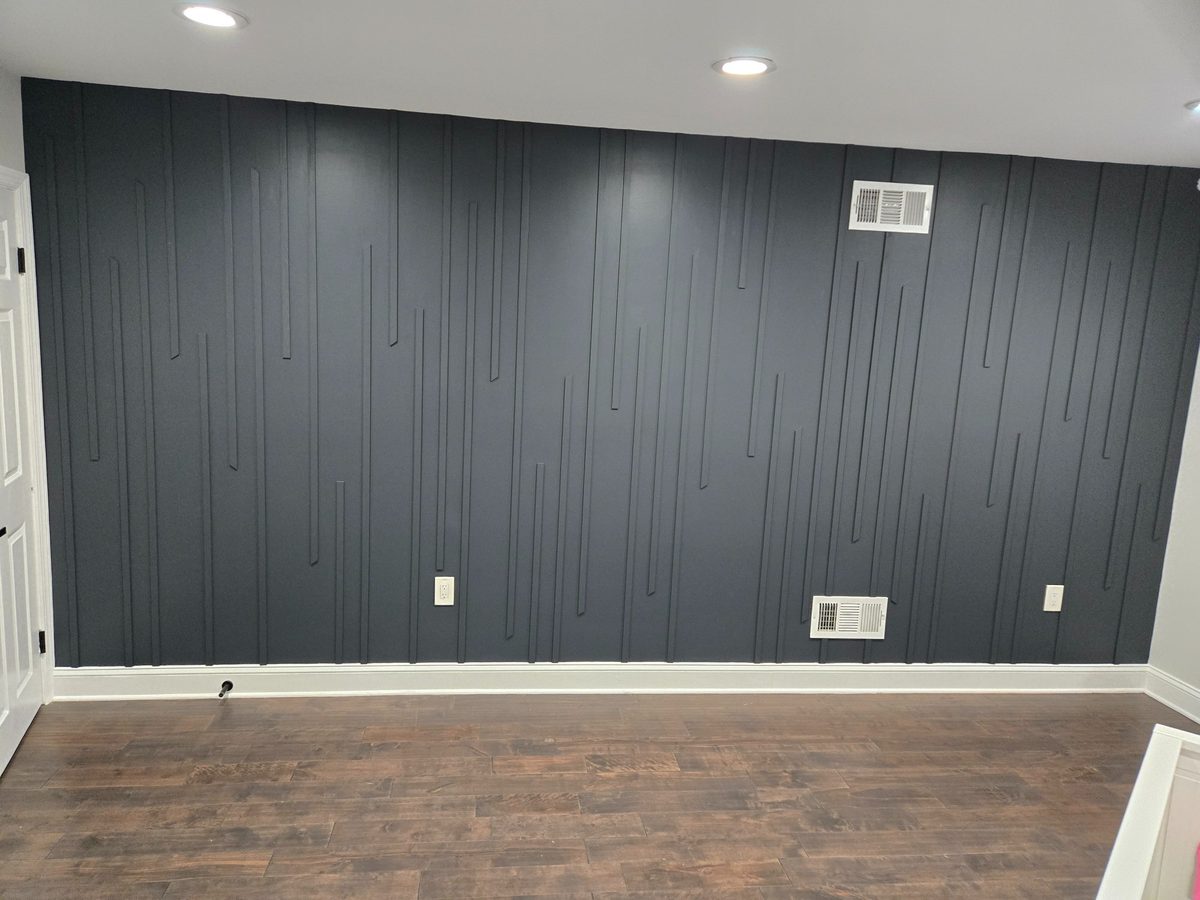 Custom accent wall dark blue vertical trim carpentry New Jersey CPR